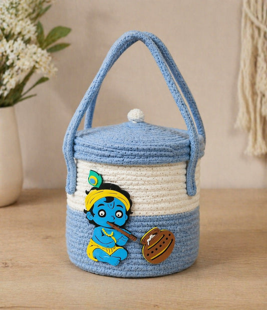 jutepie handcrafted blue and white crochet storage basket with a baby Krishna design, lid, and dual handles.
